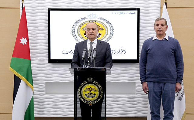 Minister of Health Saad Jaber and Minister of State for Media Affairs Amjad Adaileh hold a joint press briefing at the National Centre for Security and Crisis Management on Saturday (Petra photo)